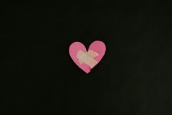 a pink heart cut out of a piece of paper